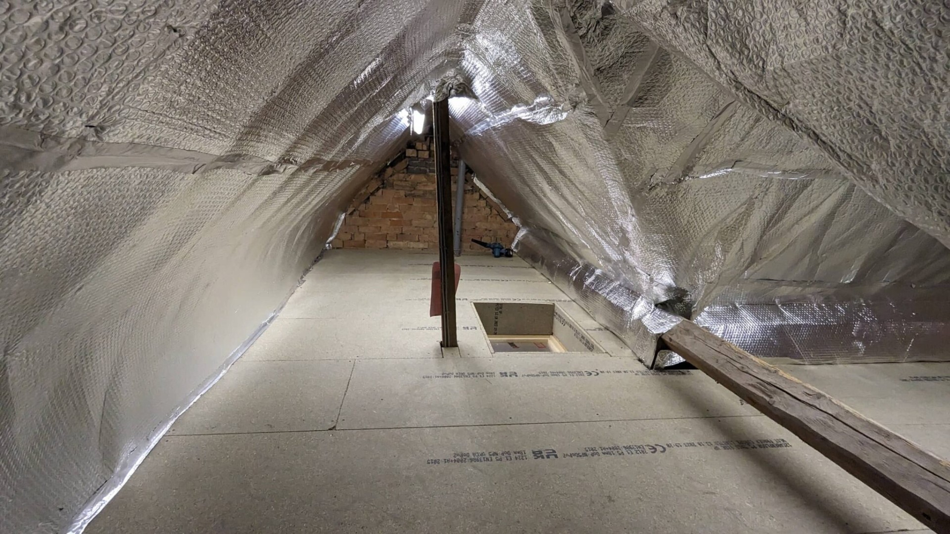Reflective foil bubble insulation lining fitted across rafters