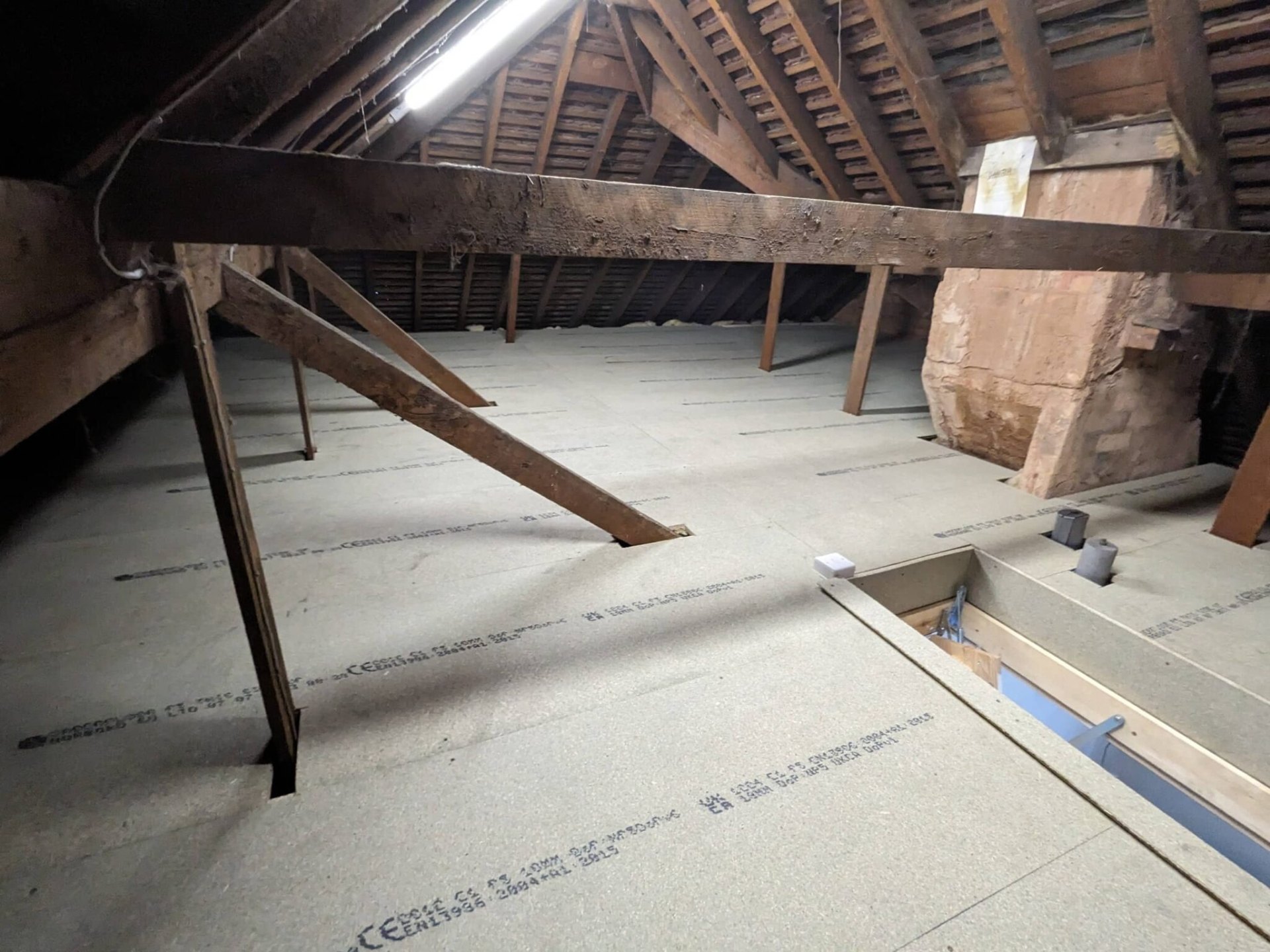 Loft Kings team installing raised loft boarding in a Solihull home
