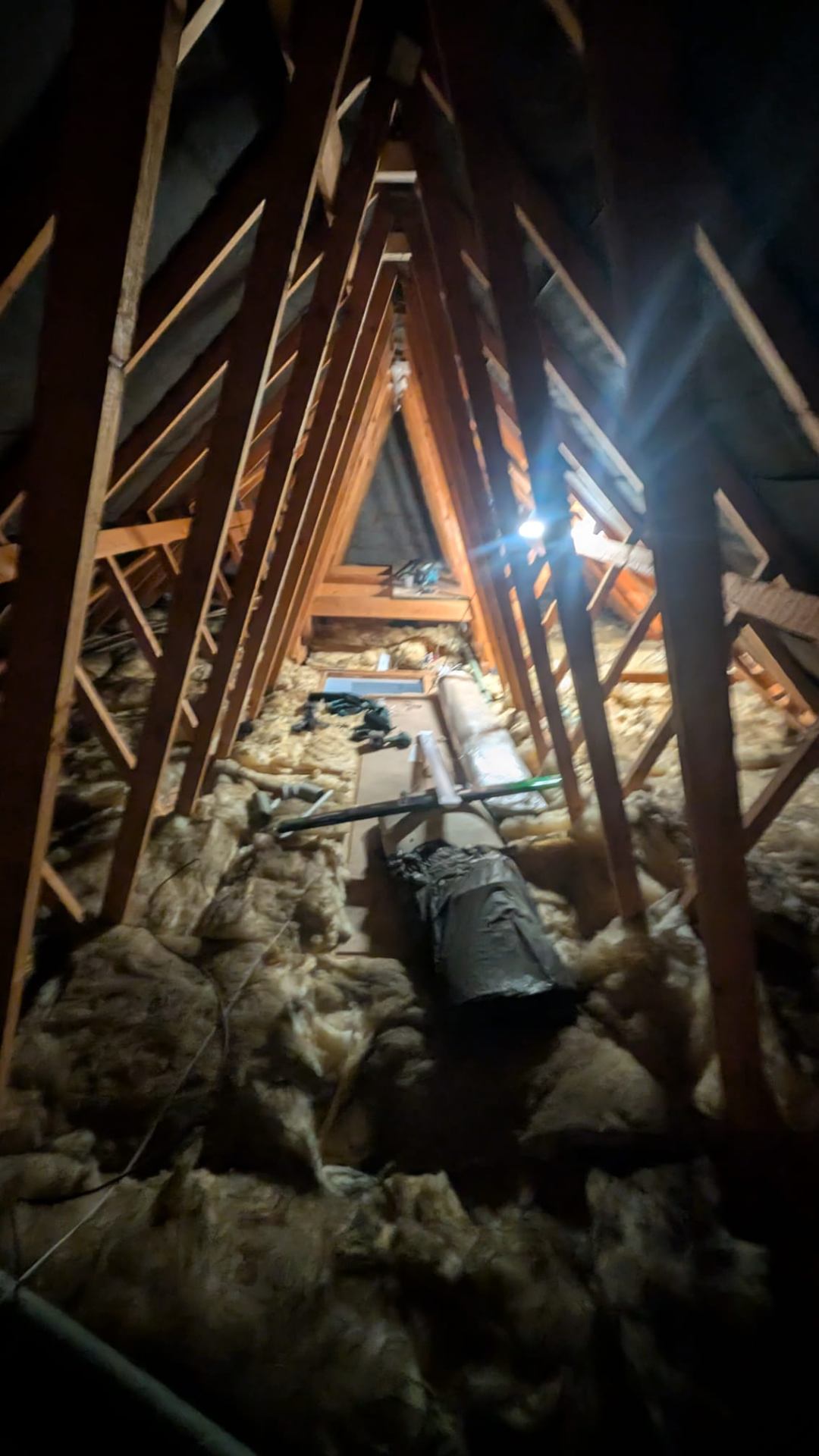 Loft boarding around water tank with safe access path