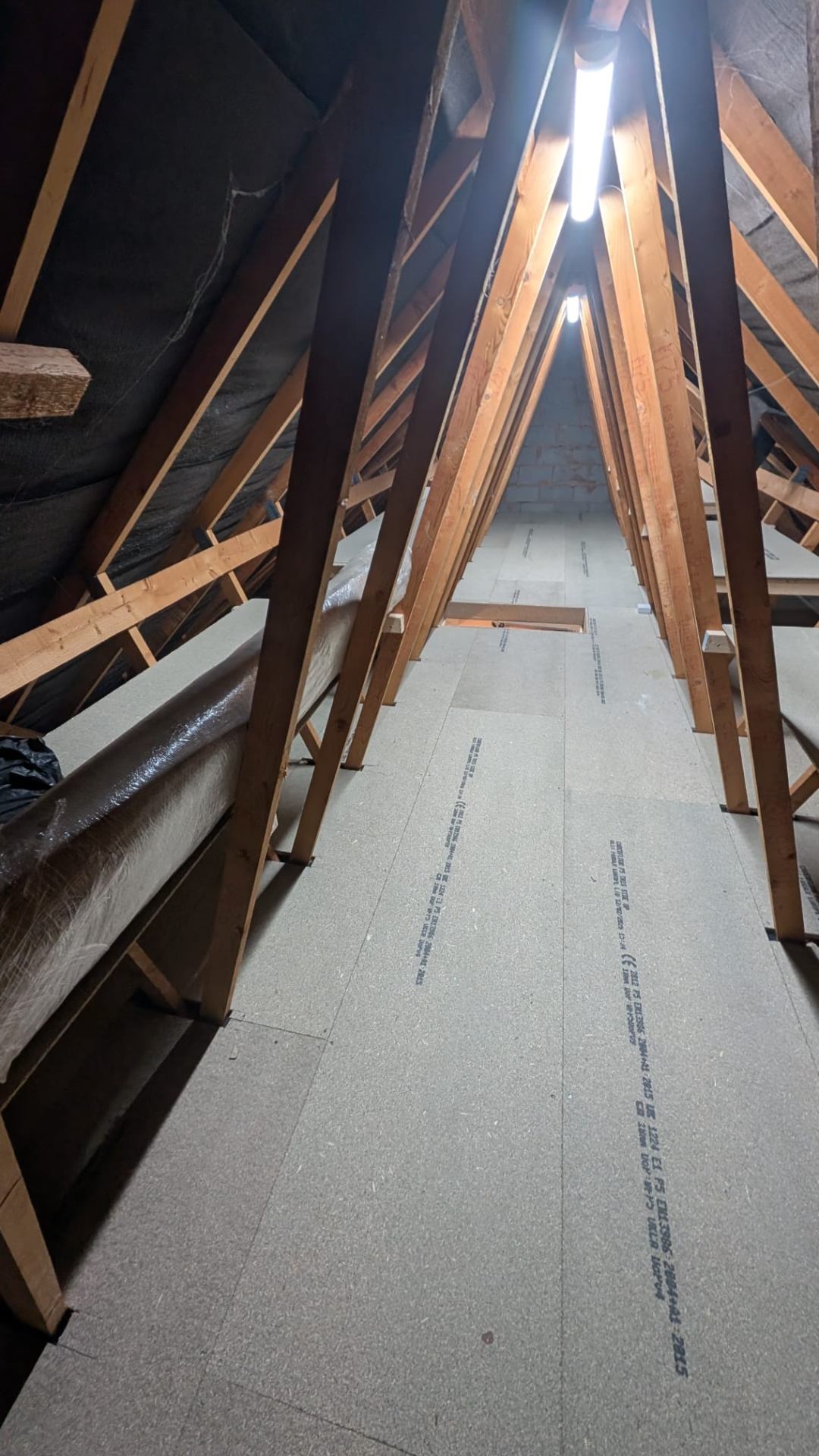 Wide loft boarding install, raised over deep insulation